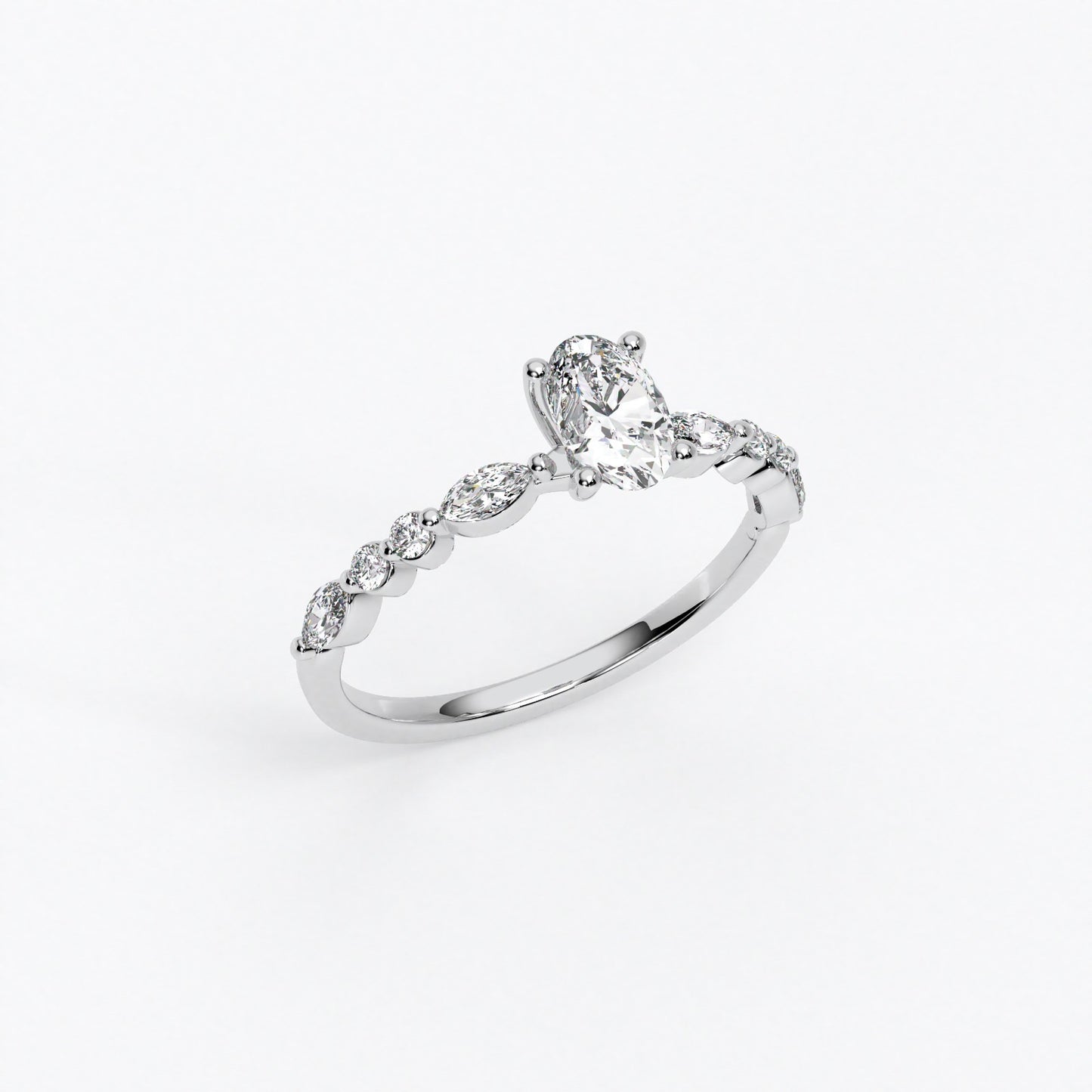 Anillo de oro de 18K con diamante oval central y diamantes laterales talla marquise