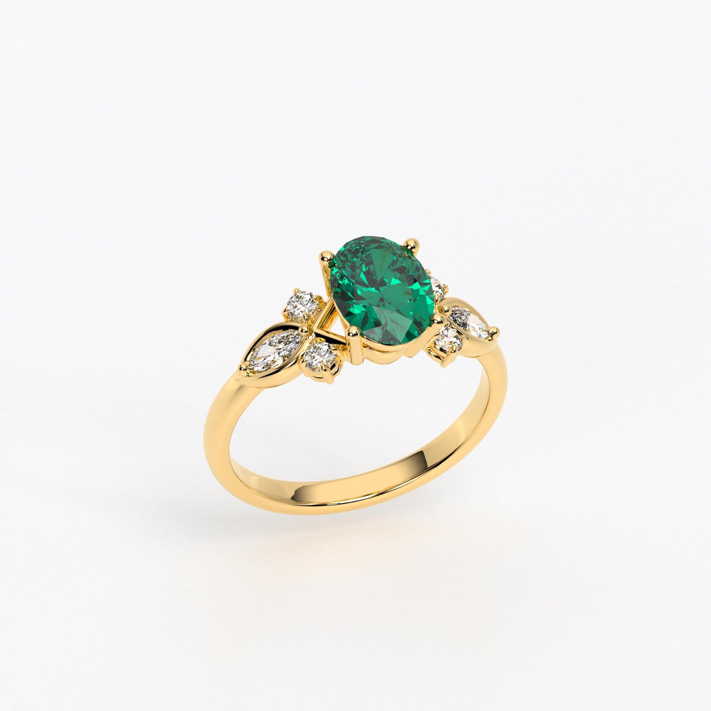 Anillo de oro de 18K con esmeralda central y diamantes en talla marquise y brillante