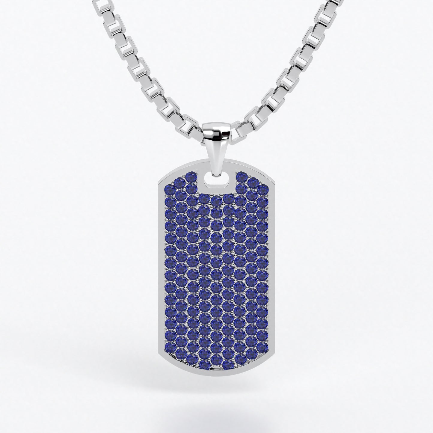Colgante de oro blanco de 18k con zafiros azules