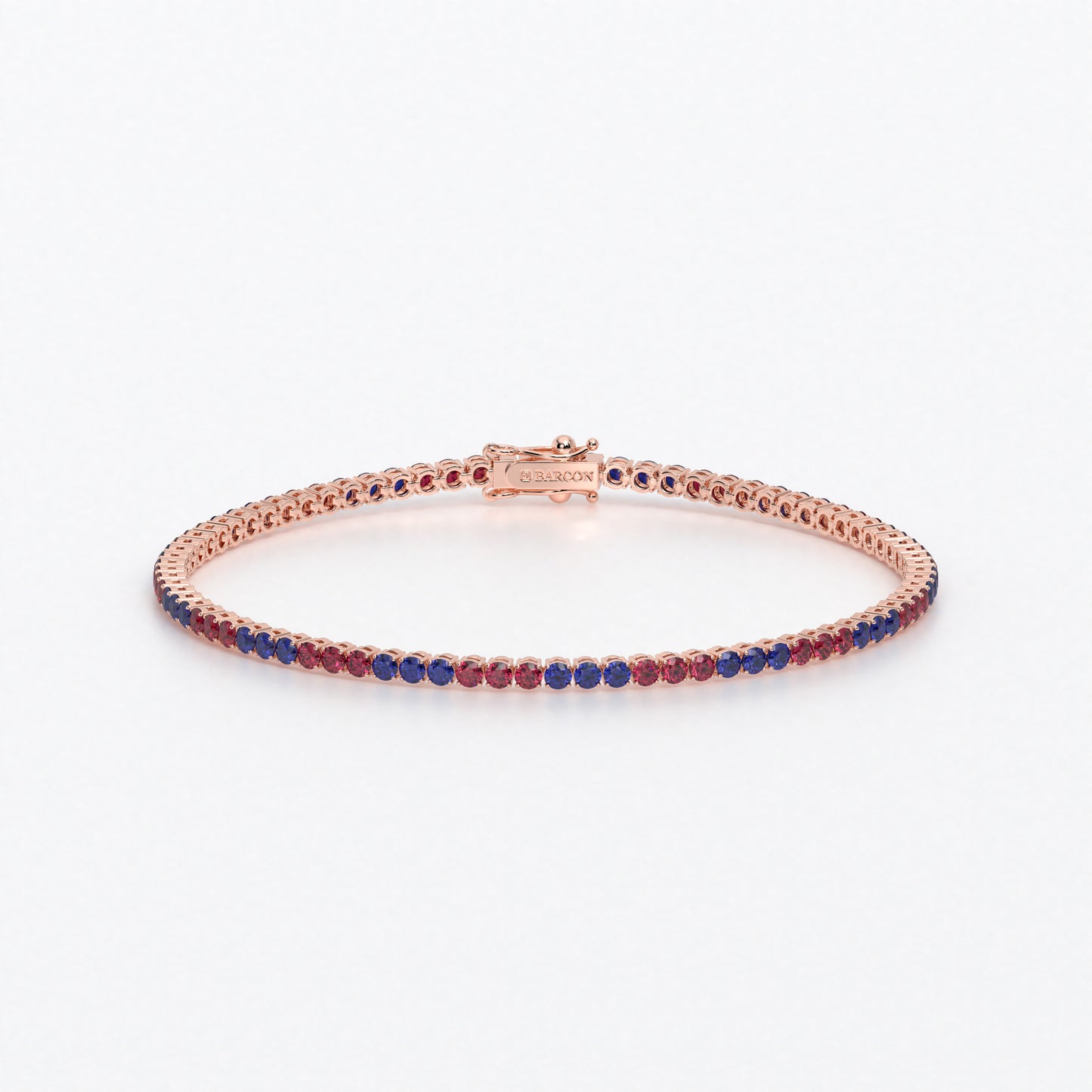 Rivière de oro de 18k con rubíes y zafiros azules en talla brillante