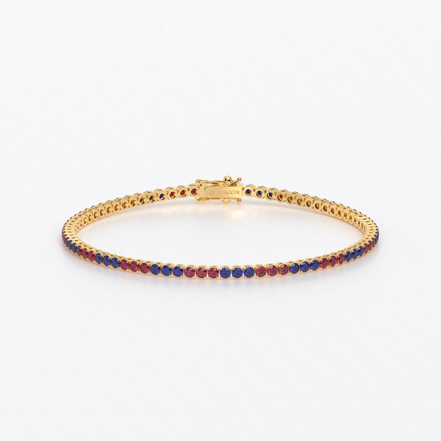 Rivière de oro de 18k con rubíes y zafiros azules en talla brillante