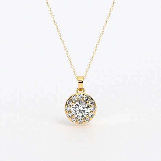 Colgante de oro de 18k con diamante blanco central en talla brillante de 0.95 cts, rodeada por un halo de diamantes blancos, con un total de 1,6cts
