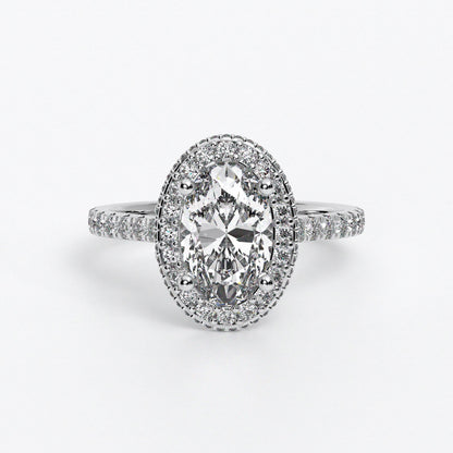 Anillo de oro blanco de 18K con diamante central talla oval rodeado con diamantes engastados en halo y brazo