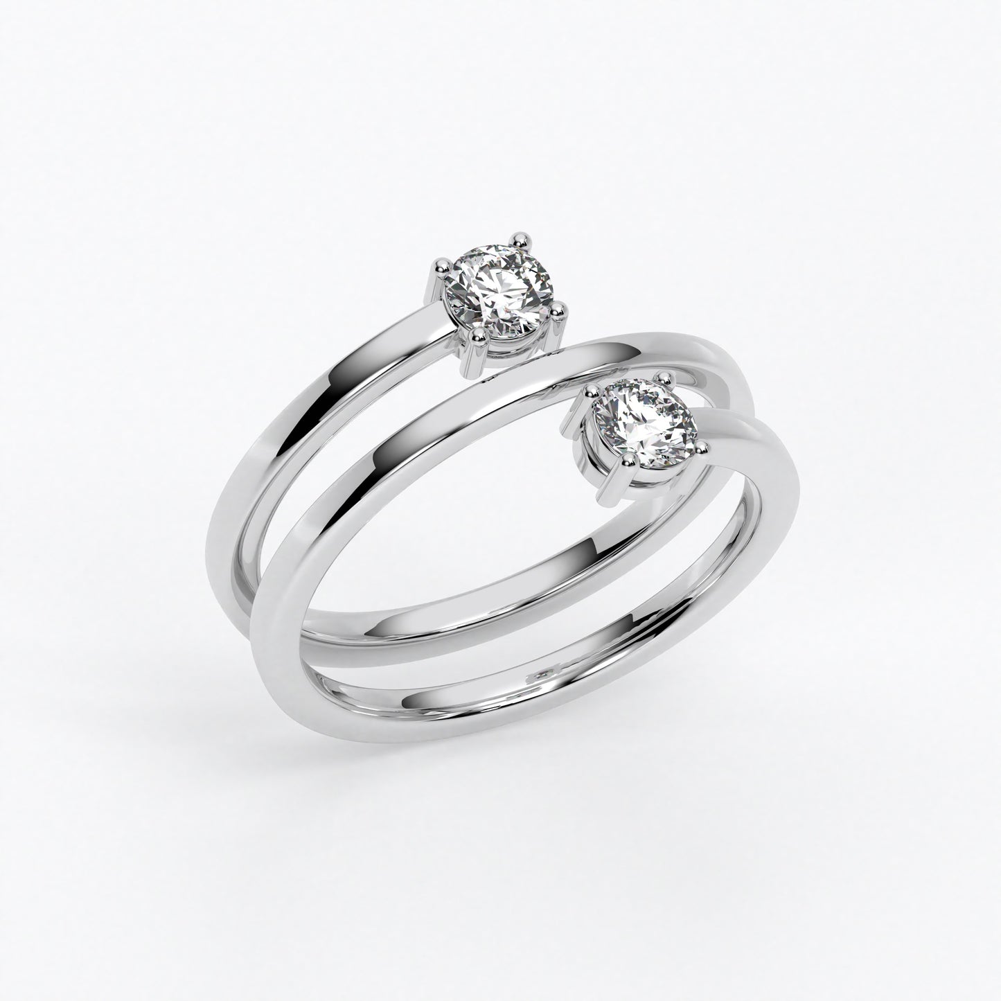 Anillo doble aro en oro blanco de 18 K con dos diamantes talla brillante