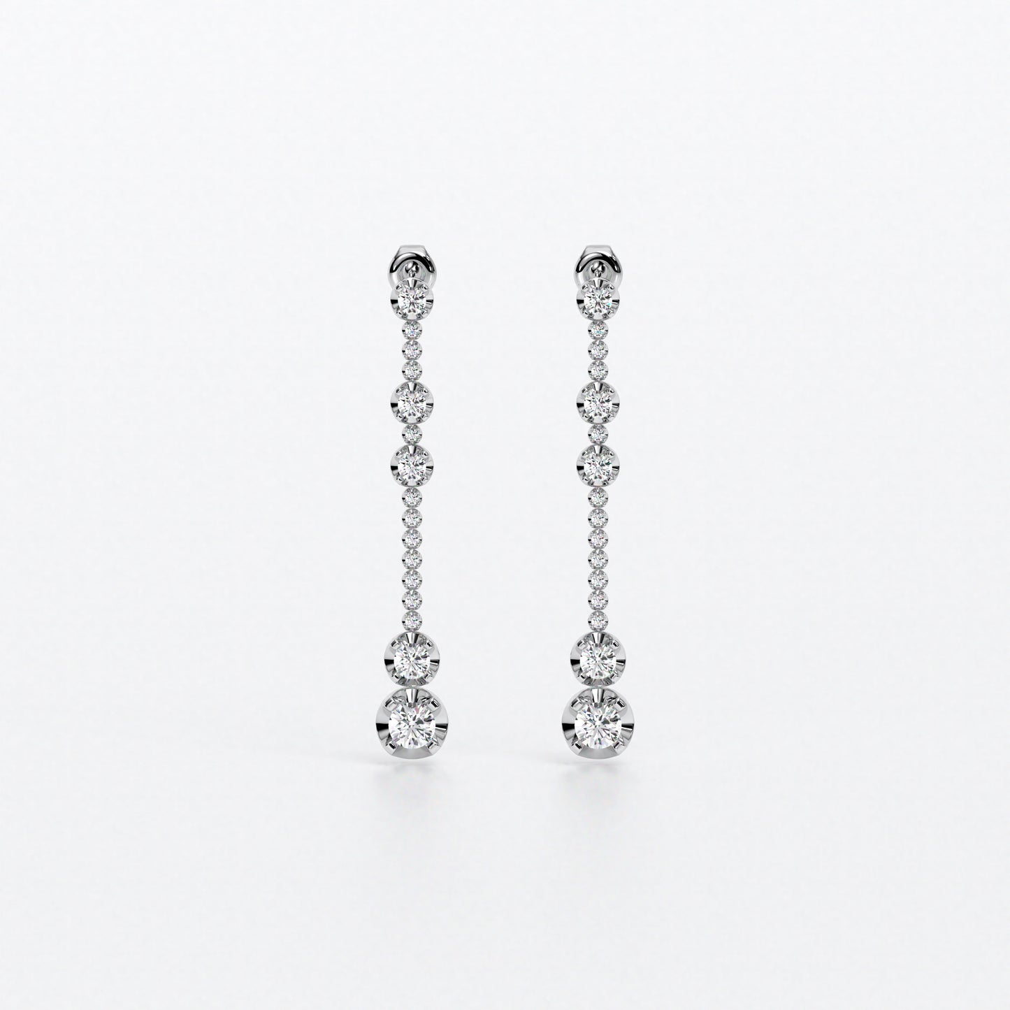 Pendientes largos en oro blanco con diamantes en línea