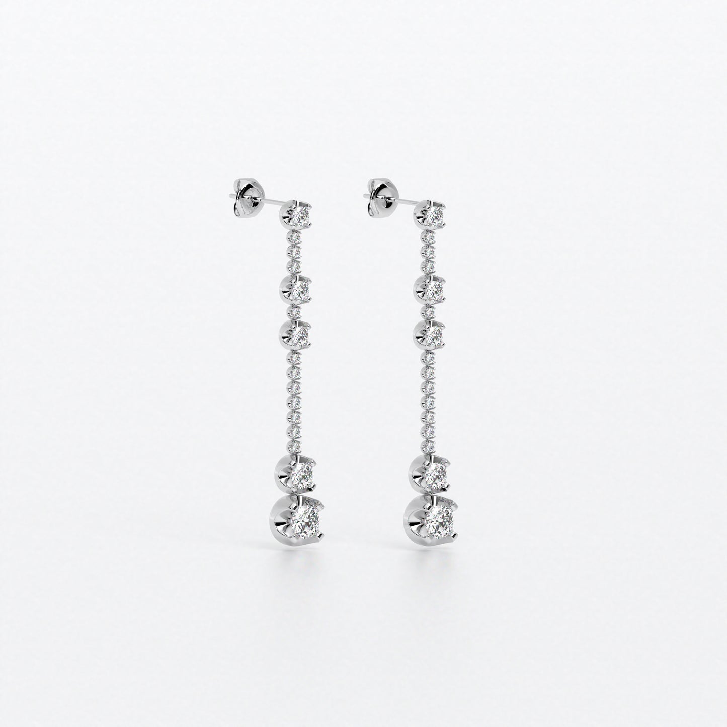 Pendientes largos en oro blanco con diamantes en línea