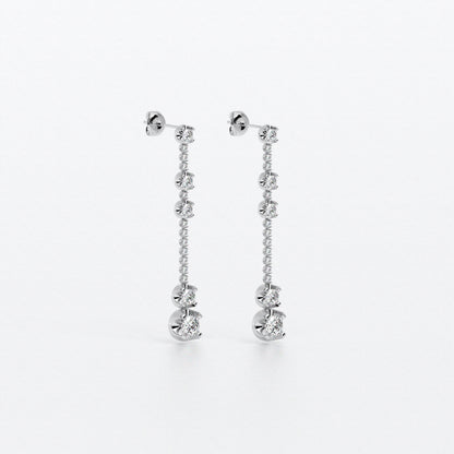 Pendientes largos en oro blanco con diamantes en línea