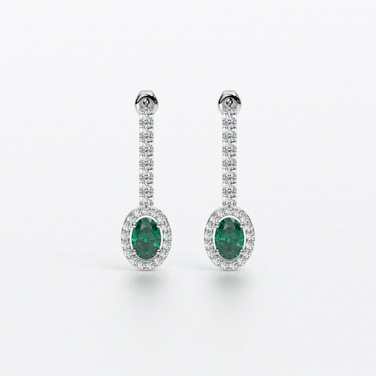 Pendientes largos en oro blanco con zafiros ovales con halo de diamantes y línea superior de diamantes