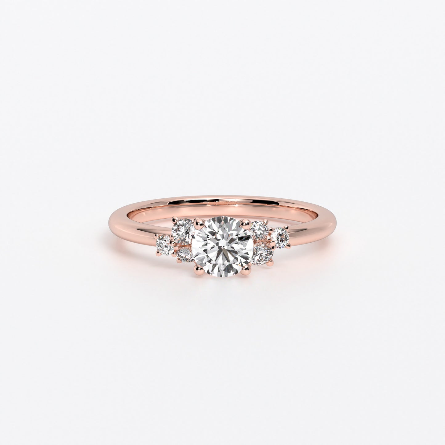 Anillo de oro blanco de 18K con diamante central talla brillante y tres diamantes laterales a cada lado