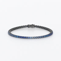 Riviere d'or de 18k amb safirs blaus en degradat en talla brillant