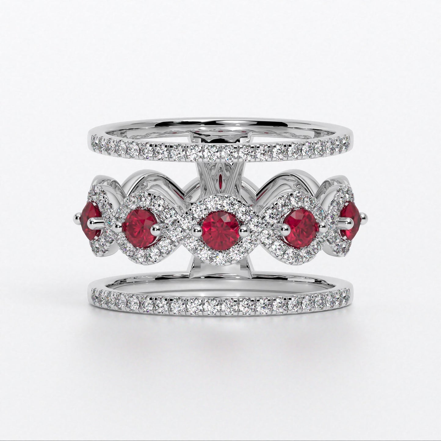 Anillo en oro blanco 18K con rubíes centrales engastados y halos de diamantes