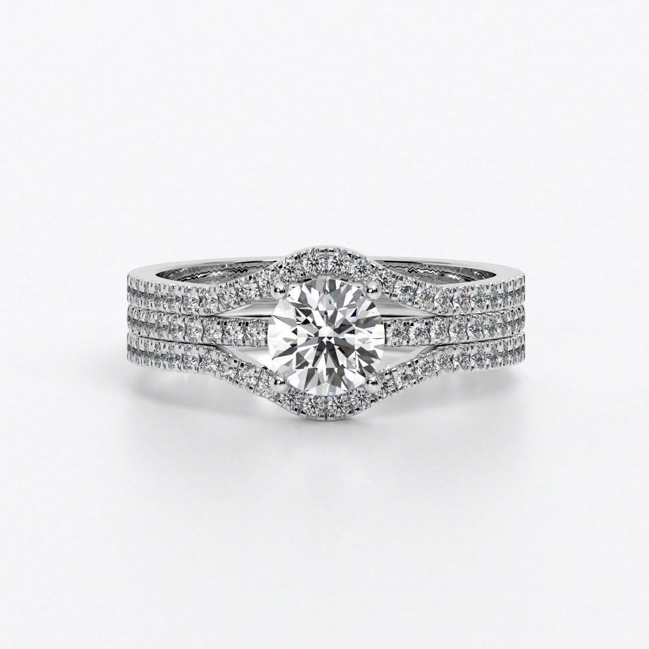 Anillo de oro blanco con diamante central talla brillante y triple pavé