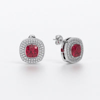 Pendientes de oro de 18K con rubí talla cushion y halo de diamantes
