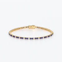 Rivière de oro de 18k con diamantes blancos y zafiros azules en talla brillante