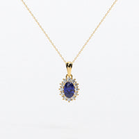 Colgante rosetón con zafiro azul natural y brillantes en oro de 18K